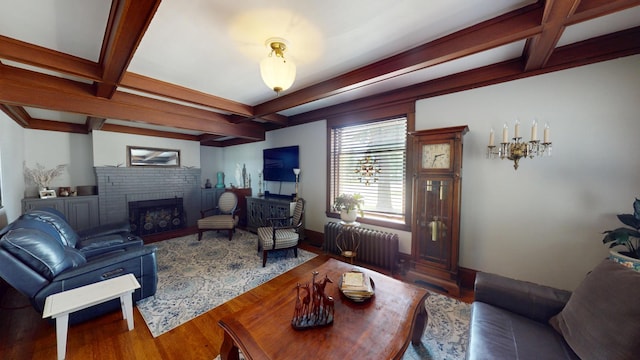 315 Fountain St, Albert Lea, MN 56007 - living room featuring radiator, coffered ceiling, beam ceiling, wood finished floors, and a brick fireplace