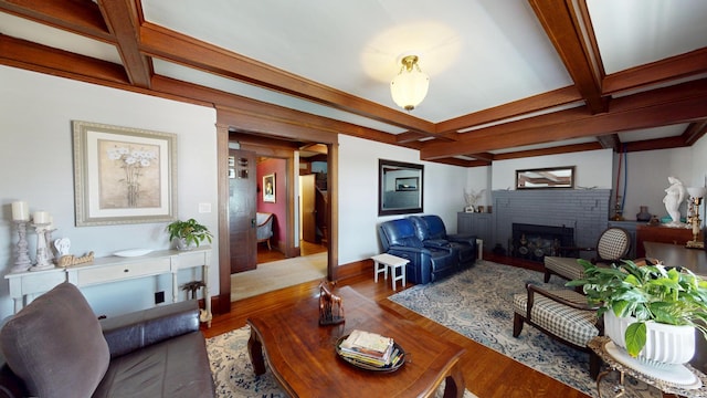 315 Fountain St, Albert Lea, MN 56007 - living room featuring coffered ceiling, a fireplace, beam ceiling, and wood finished floors