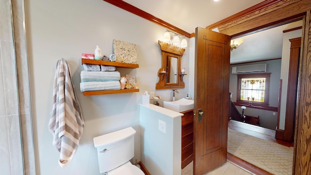 315 Fountain St, Albert Lea, MN 56007 - bathroom featuring a wall unit AC, crown molding, and wood finished floors