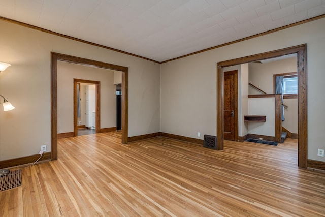 616 5th St, Mankato, MN 56001 - unfurnished room featuring ornamental molding, light wood-type flooring, and stairs