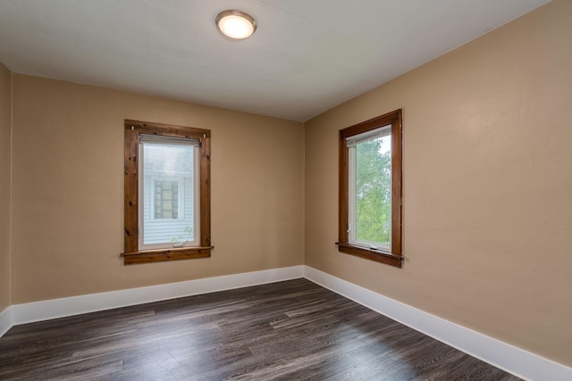 616 5th St, Mankato, MN 56001 - empty room with dark wood-style flooring and baseboards