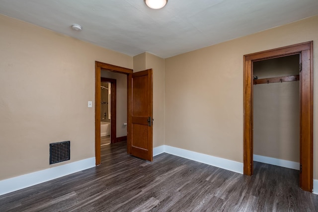 616 5th St, Mankato, MN 56001 - unfurnished bedroom featuring dark wood-type flooring and a closet
