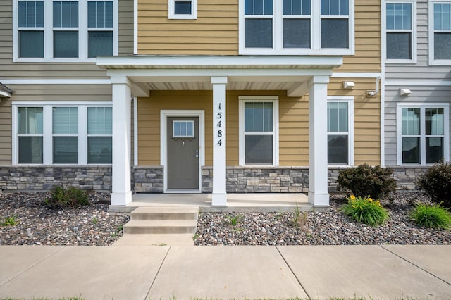 15484 Eames Way, Apple Valley, MN 55124 - view of exterior entry featuring covered porch and stone siding