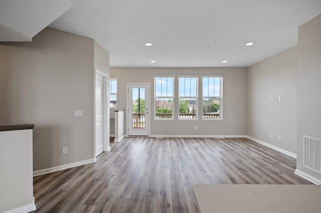 15484 Eames Way, Apple Valley, MN 55124 - unfurnished living room featuring wood finished floors and recessed lighting