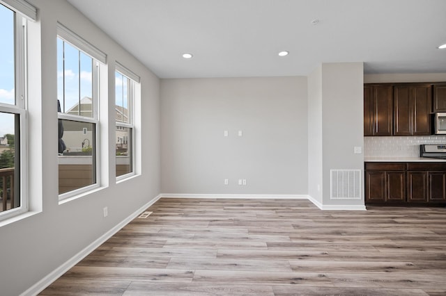 15484 Eames Way, Apple Valley, MN 55124 - unfurnished living room with light wood-type flooring and recessed lighting