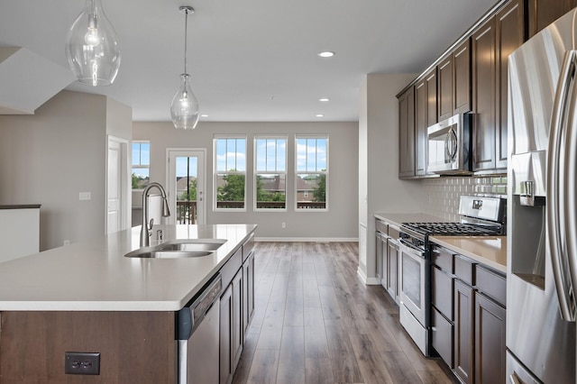 15484 Eames Way, Apple Valley, MN 55124 - kitchen featuring stainless steel appliances, dark wood finished floors, light countertops, dark brown cabinets, and recessed lighting