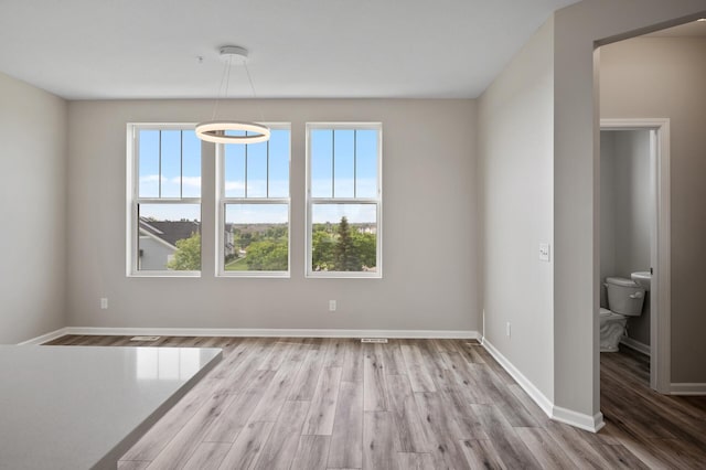 15484 Eames Way, Apple Valley, MN 55124 - spare room with plenty of natural light and wood finished floors