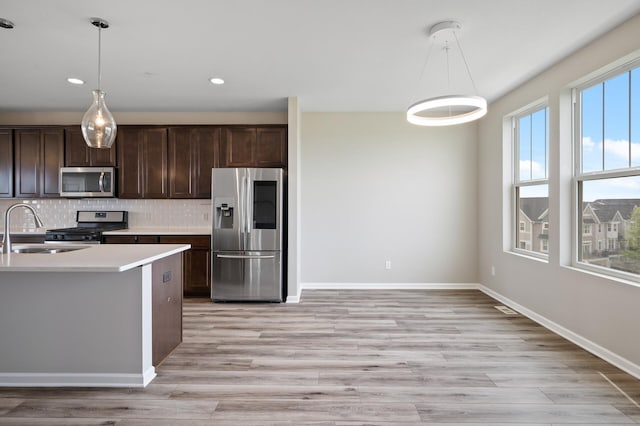 15484 Eames Way, Apple Valley, MN 55124 - kitchen featuring appliances with stainless steel finishes, dark brown cabinetry, pendant lighting, and recessed lighting
