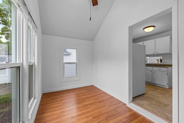 1175 Seminary Ave, Saint Paul, MN 55104 - empty room featuring vaulted ceiling, light wood-style flooring, and a ceiling fan