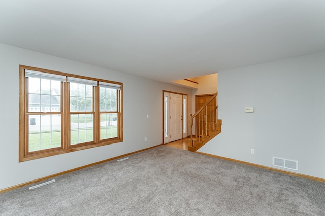 2319 Viola View Ln NE, Rochester, MN 55906 - unfurnished room with light colored carpet and stairs