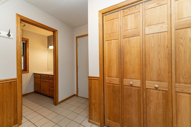2319 Viola View Ln NE, Rochester, MN 55906 - hallway featuring a textured ceiling and light tile patterned floors