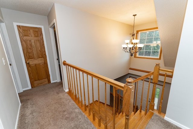 2319 Viola View Ln NE, Rochester, MN 55906 - staircase featuring a chandelier and carpet flooring