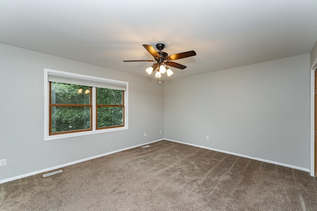 2319 Viola View Ln NE, Rochester, MN 55906 - empty room featuring a ceiling fan and dark carpet