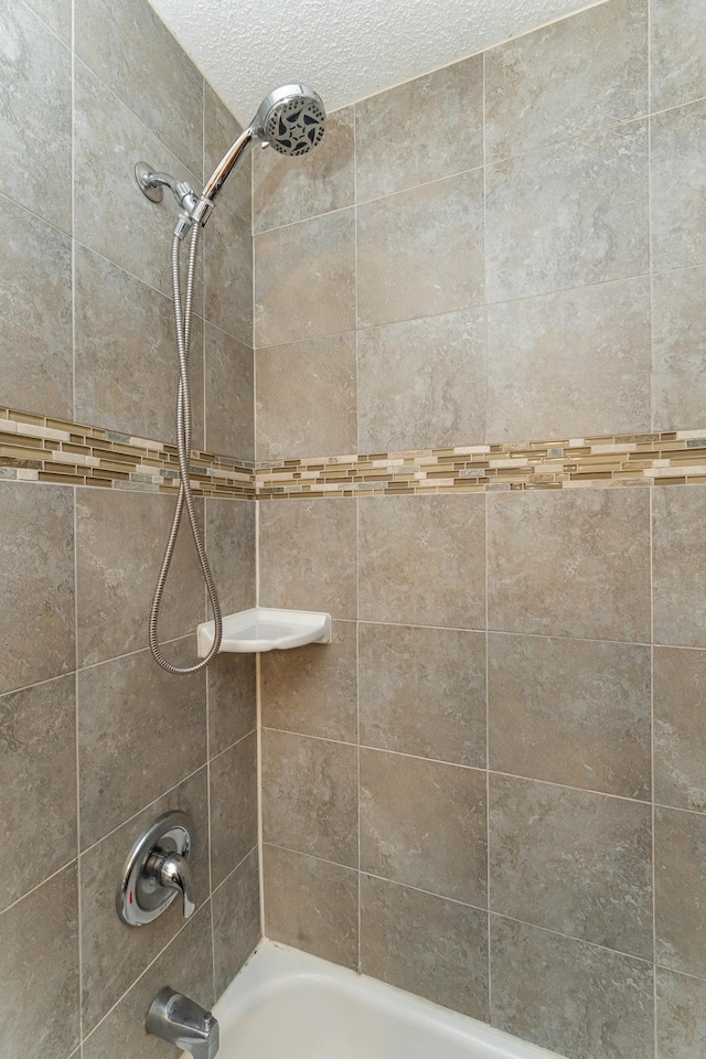 2319 Viola View Ln NE, Rochester, MN 55906 - bathroom featuring  shower combination and a textured ceiling