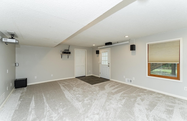 2319 Viola View Ln NE, Rochester, MN 55906 - empty room with carpet flooring, a textured ceiling, and recessed lighting