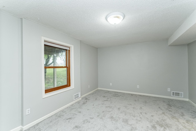 2319 Viola View Ln NE, Rochester, MN 55906 - spare room featuring a textured ceiling and carpet flooring