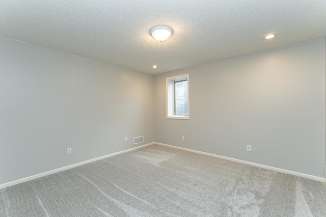 2319 Viola View Ln NE, Rochester, MN 55906 - unfurnished room featuring a textured ceiling, light colored carpet, and recessed lighting