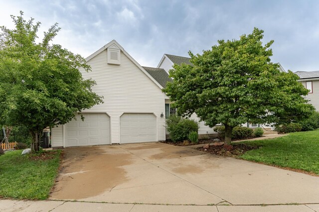 2319 Viola View Ln NE, Rochester, MN 55906 - view of home's exterior featuring concrete driveway and a garage