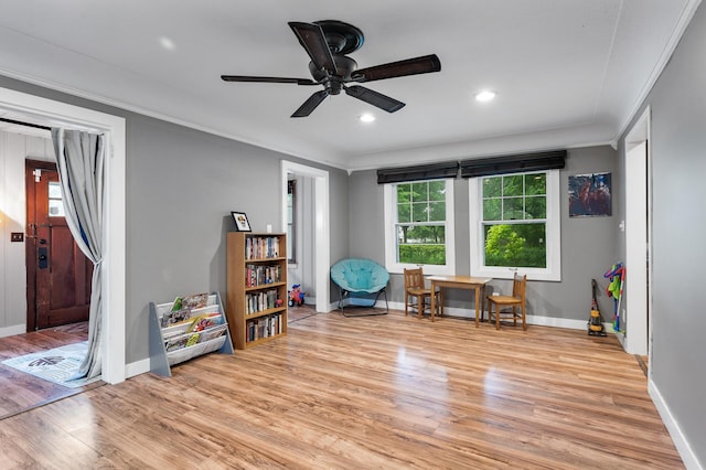 3256 Sheridan Ave N, Minneapolis, MN 55412 - living area with light wood finished floors, ceiling fan, ornamental molding, and recessed lighting