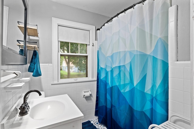 3256 Sheridan Ave N, Minneapolis, MN 55412 - bathroom with tile walls, vanity, and curtained shower