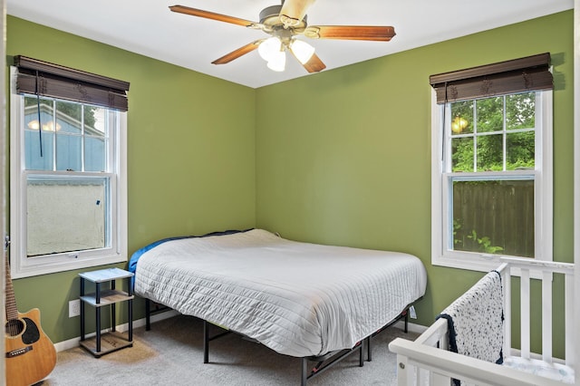 3256 Sheridan Ave N, Minneapolis, MN 55412 - carpeted bedroom featuring multiple windows and ceiling fan