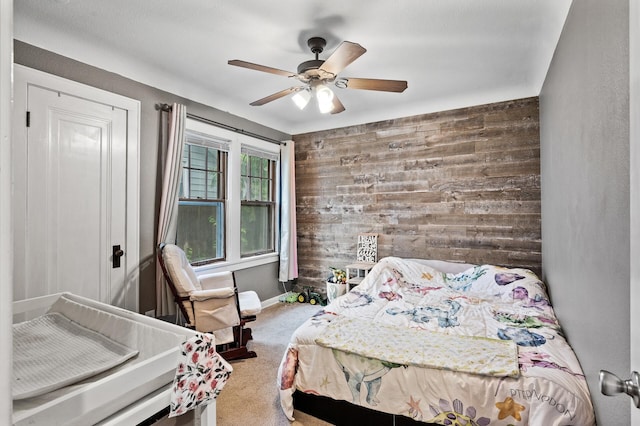 3256 Sheridan Ave N, Minneapolis, MN 55412 - carpeted bedroom featuring wood walls and ceiling fan
