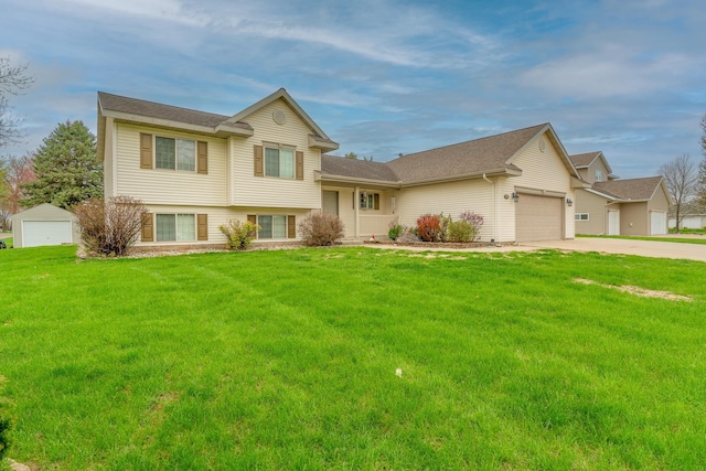 704 Main St, Madelia, MN 56062 - split level home with a front lawn, an attached garage, and driveway