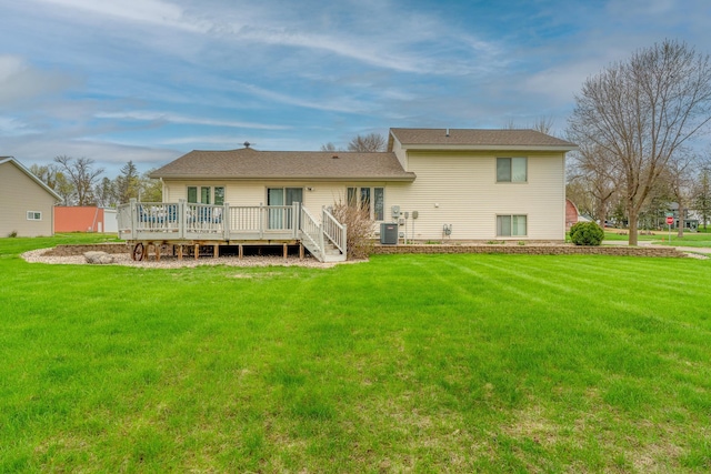 704 Main St, Madelia, MN 56062 - back of property featuring a deck and a lawn