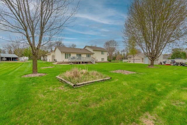 704 Main St, Madelia, MN 56062 - view of green lawn with a wooden deck