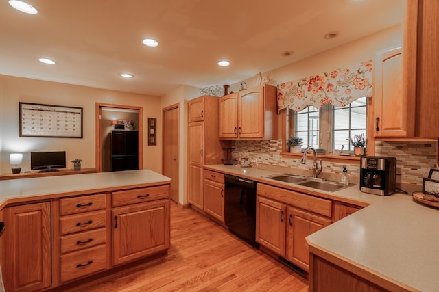 704 Main St, Madelia, MN 56062 - kitchen with black dishwasher, light countertops, light wood-style floors, backsplash, and recessed lighting
