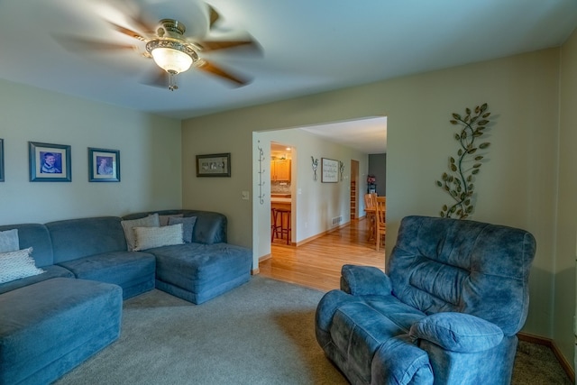 704 Main St, Madelia, MN 56062 - carpeted living area featuring ceiling fan