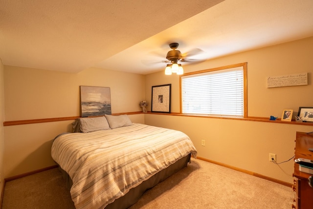 704 Main St, Madelia, MN 56062 - carpeted bedroom with baseboards and ceiling fan