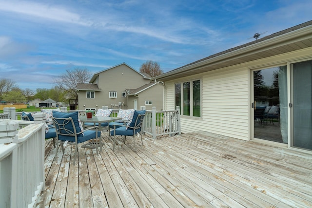 704 Main St, Madelia, MN 56062 - wooden deck featuring outdoor dining space