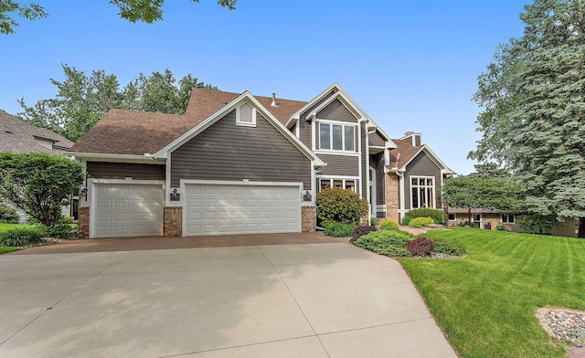 11582 Raspberry Hill Rd, Eden Prairie, MN 55344 - traditional home with brick siding, concrete driveway, an attached garage, and a front lawn