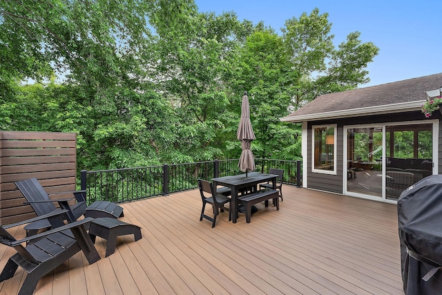11582 Raspberry Hill Rd, Eden Prairie, MN 55344 - wooden deck with outdoor dining space and a grill