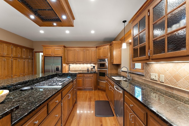 11582 Raspberry Hill Rd, Eden Prairie, MN 55344 - kitchen with stainless steel appliances, light wood-type flooring, brown cabinets, range hood, and recessed lighting