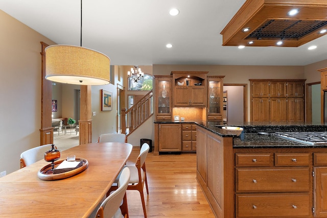 11582 Raspberry Hill Rd, Eden Prairie, MN 55344 - kitchen featuring custom range hood, light wood finished floors, a chandelier, brown cabinets, and recessed lighting