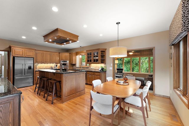 11582 Raspberry Hill Rd, Eden Prairie, MN 55344 - dining space with light wood finished floors and recessed lighting
