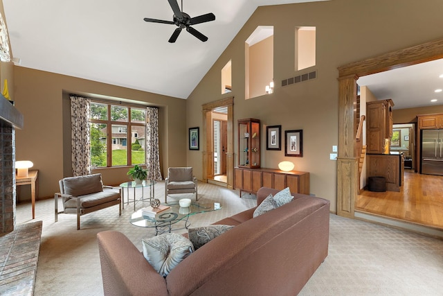 11582 Raspberry Hill Rd, Eden Prairie, MN 55344 - living area featuring high vaulted ceiling, a fireplace, a ceiling fan, and light carpet
