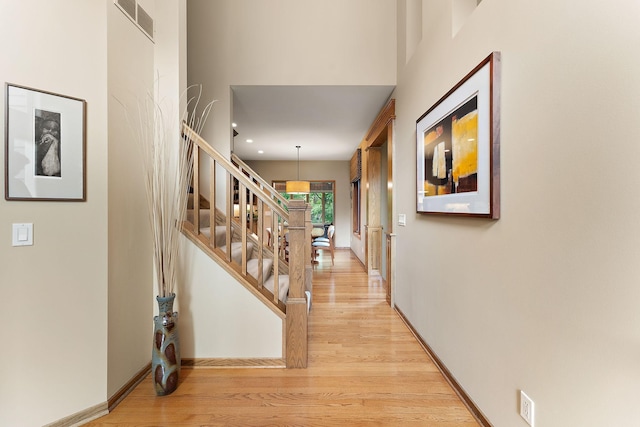 11582 Raspberry Hill Rd, Eden Prairie, MN 55344 - foyer entrance featuring light wood finished floors, stairway, recessed lighting, and a towering ceiling