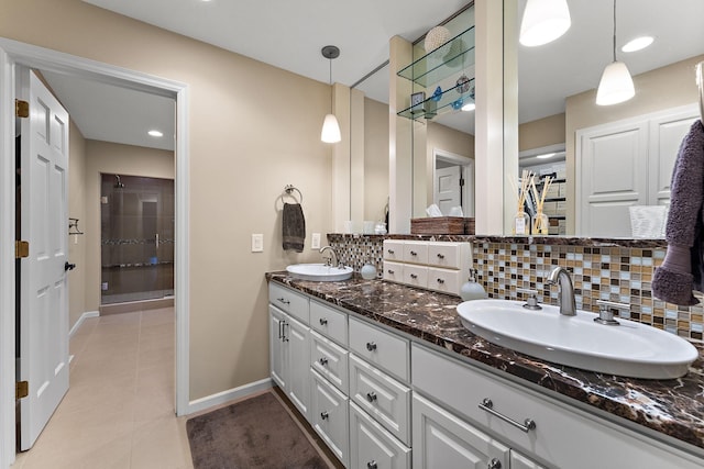 11582 Raspberry Hill Rd, Eden Prairie, MN 55344 - bathroom with double vanity, tasteful backsplash, tile patterned floors, and tiled shower