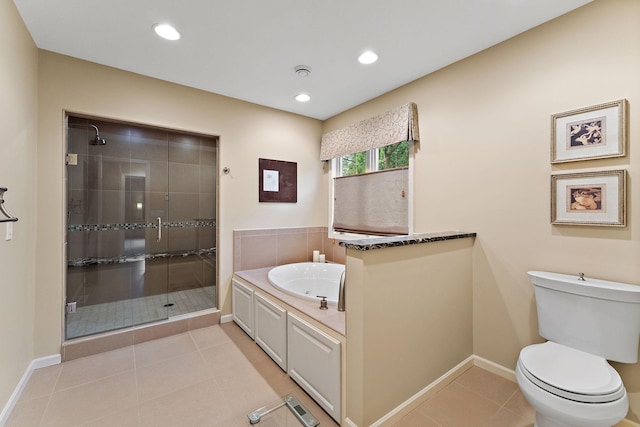 11582 Raspberry Hill Rd, Eden Prairie, MN 55344 - bathroom with a stall shower, tile patterned flooring, a bath, and recessed lighting