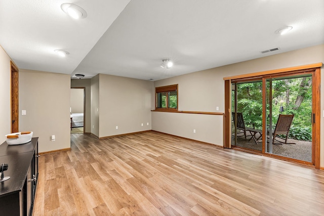 11582 Raspberry Hill Rd, Eden Prairie, MN 55344 - unfurnished living room featuring light wood-type flooring and baseboards
