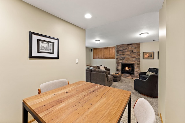 11582 Raspberry Hill Rd, Eden Prairie, MN 55344 - dining room featuring a fireplace and carpet flooring
