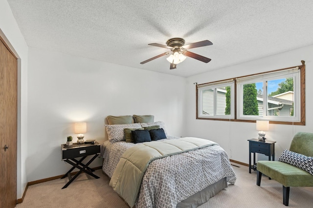 507 17 1/2 St SE, Rochester, MN 55904 - bedroom featuring light carpet, a closet, a textured ceiling, and a ceiling fan