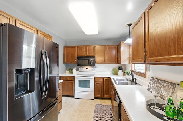 507 17 1/2 St SE, Rochester, MN 55904 - kitchen featuring black appliances, brown cabinets, light countertops, and hanging light fixtures