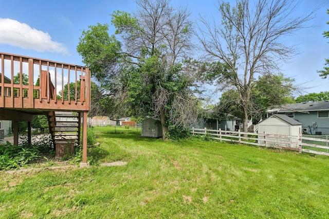 507 17 1/2 St SE, Rochester, MN 55904 - fenced backyard featuring a shed, a deck, and stairway