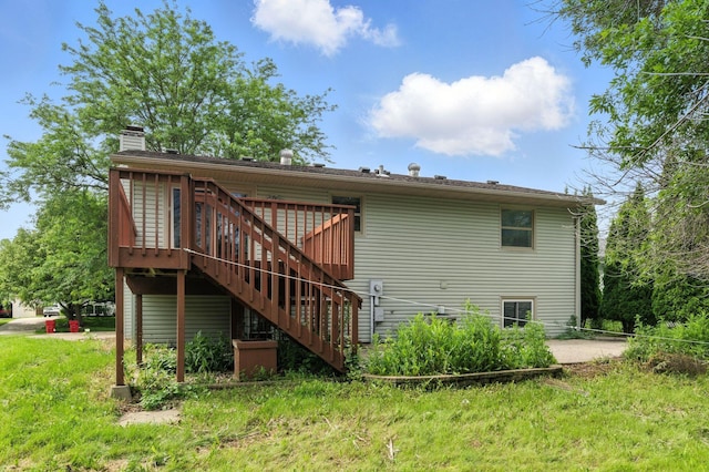 507 17 1/2 St SE, Rochester, MN 55904 - back of property with stairway, a deck, and a chimney