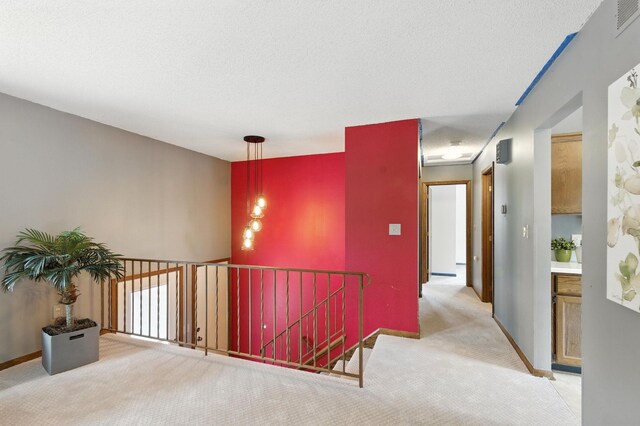 507 17 1/2 St SE, Rochester, MN 55904 - hallway with carpet flooring and an upstairs landing