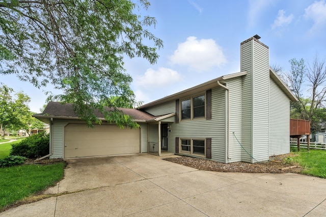 507 17 1/2 St SE, Rochester, MN 55904 - view of front of property featuring a chimney, an attached garage, and driveway